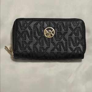 NX  Black Wallet with Monogram Pattern and Gold Emblem EUC